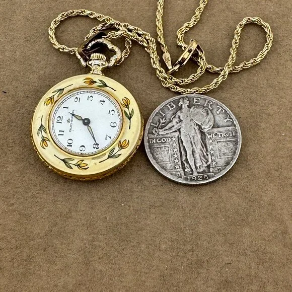 Bucherer pendant watch boasts an enamel flower bezel and a 